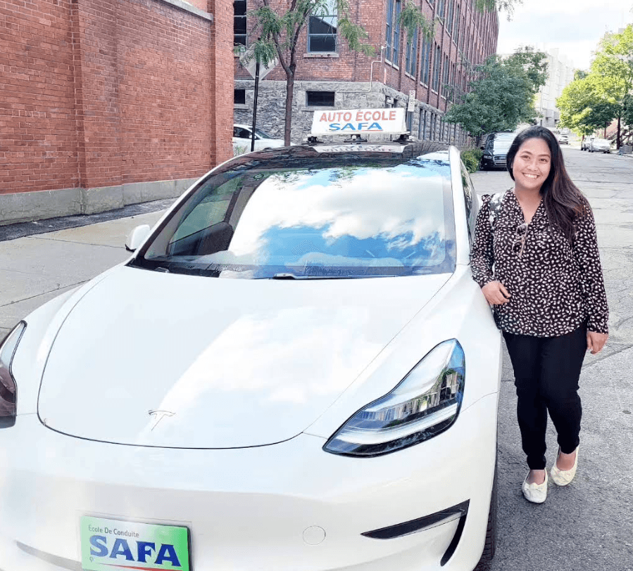 Calm instructor coaching a nervous driver on the highway